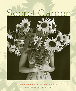 On the Secret Garden book cover, a nude woman holds a giant bouquet of sunflowers, her face and breasts almost hidden within the foliage.