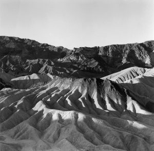 Furrows in the Death Valley landscape are seen head on (left half of diptych)